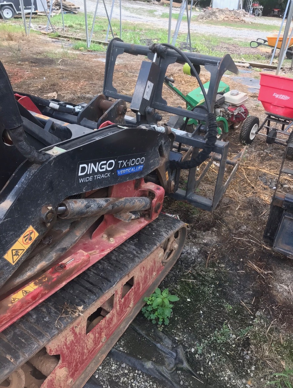 Toro Dingo TX 1000 Wide Track with grapple attachment
